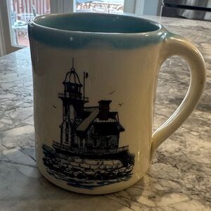 Cream Ceramic Mug with Blue Interior and Lighthouse Illustration